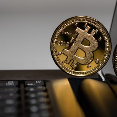 two gold Bitcoins